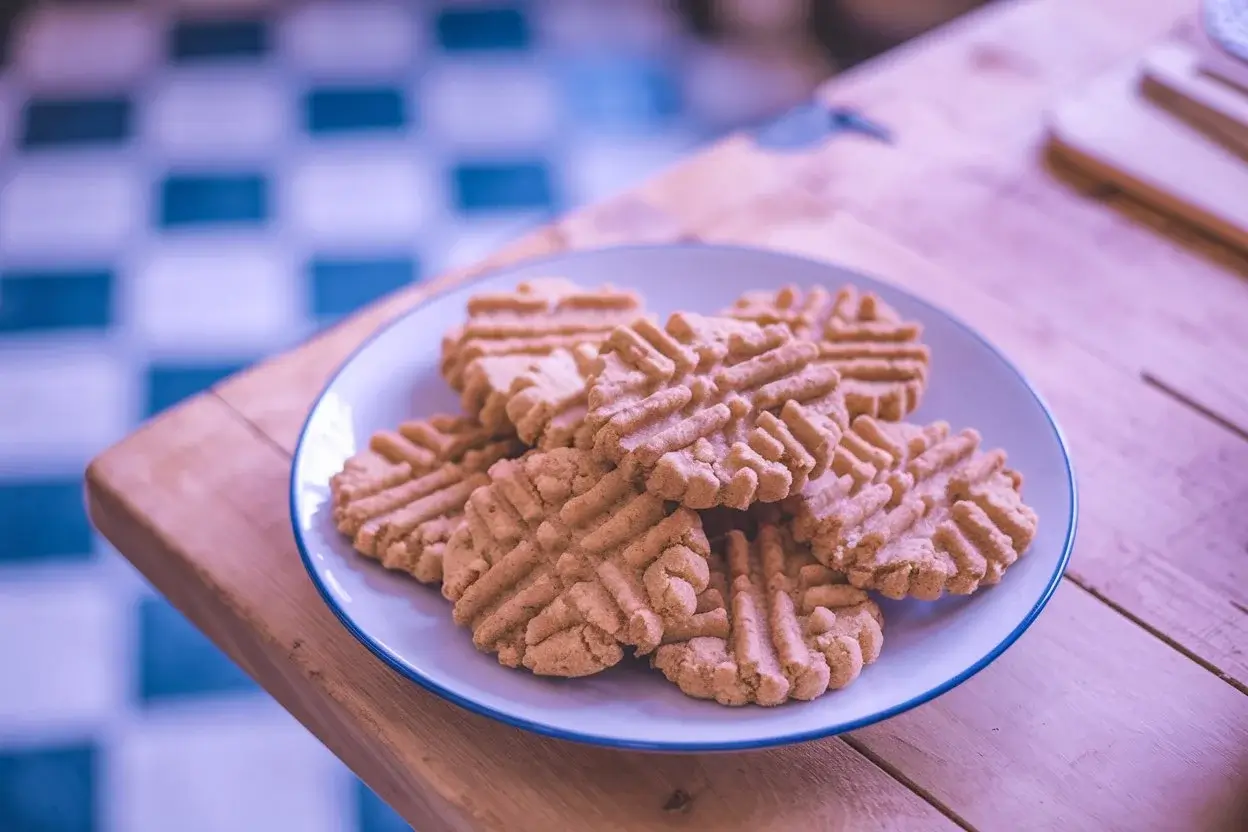 Freshly baked 4 ingredient peanut butter cookies on a plate, ready to eat.